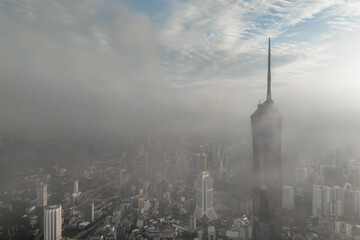 Aerial view PNB118 Tower in Kuala Lumpur City during Low Clouds Monsoon