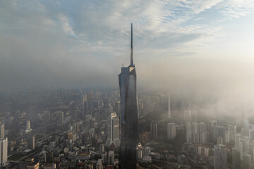 Aerial view PNB118 Tower in Kuala Lumpur City during Low Clouds Monsoon
