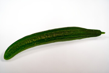 Close-up of green cucumber against white background. Photo taken June 22nd, 2024, Zurich, Switzerland.