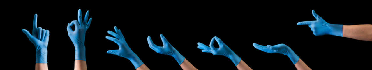 Doctor's hand in sterile medical gloves showing gesture or something on black