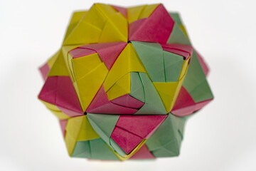 Obraz premium Top view of abstract colorful cube lying on white background. Photo taken June 22nd, 2024, Zurich, Switzerland.