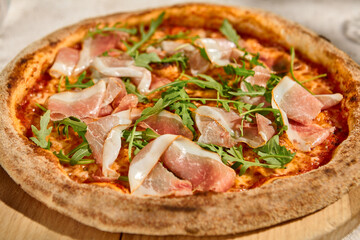 Pizza with Parma Ham and Arugula in Summer Sunlight and Shadows