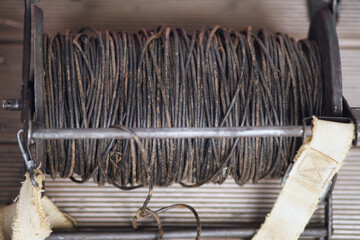 Spool of communication wire on a metal reel. Field communication equipment used in military or emergency services of the USSR during the Second World War. Historical items from the Soviet Union