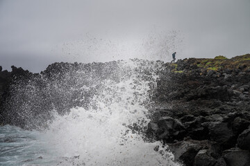 waves crashing on rocks