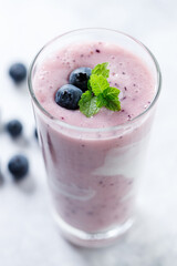 Blueberry smoothie with yogurt in a glass.