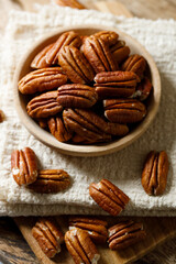 Pecan nuts in a wooden bowl