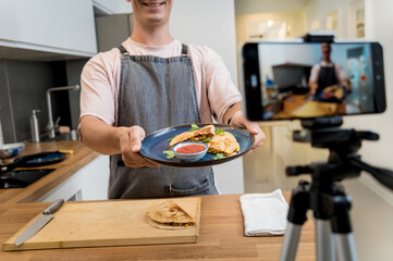 The chef is broadcasting live from workshop how to prepare a vegetarian food