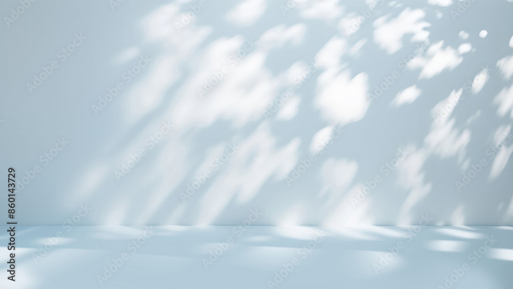 Poster Minimalistic simple background with blurred foliage shadow on light blue wall. Beautiful background for presentation.