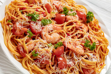 shrimp fra diavolo with spaghetti on a plate