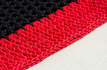Polyester cords in red and black. Durable cord for knitting bags, baskets and string bags.