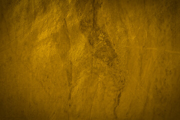 Golden old concrete wall in closeup