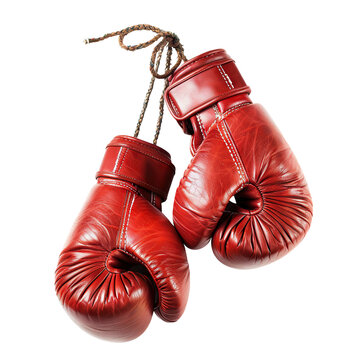 Pair of old red leather boxing gloves hanging, cut out