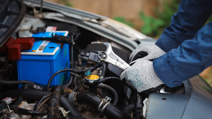 Car care and service A technician is troubleshooting an engine. Spare parts of car engines that...