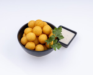 Potato croquettes, mashed potatoes balls breaded and deep fried. Dark background. Top view.