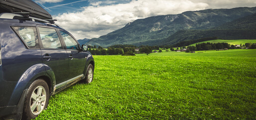 car for traveling with a mountain road © nickolya