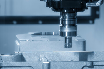 The CNC milling machine rough cutting the casting aluminum parts by indexable tools.