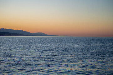 Sunrise over the beach and city in Malaga, Spain