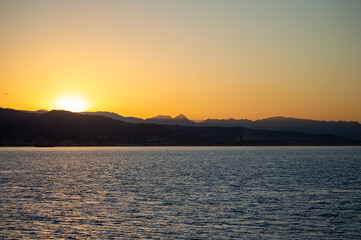 Naklejka premium Sunrise over the beach and city in Malaga, Spain