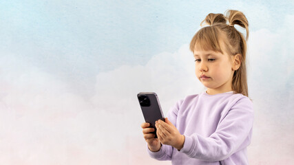 Petite girl with calm expression looks at phone screen