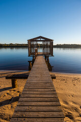 Wooden jetty with old wooden boat house at Maroochy River, Queensland, Australia.