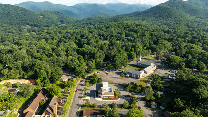 Aerial view of Black Mountain, NC, showcasing a charming town surrounded by lush green forests and mountainous landscape.