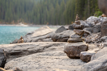 Balancing stones on the shore of the lake. Stack of stones, Pile of rocks, stones tower. Spirit of Zen.