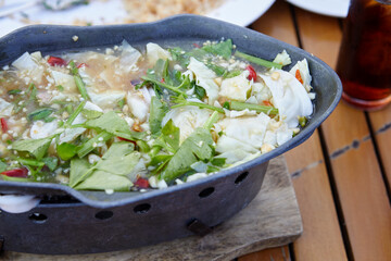 Steamed squid with spicy chili and sour sauce in hot pot