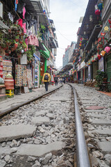 Hanoi, Vietnam - 29 Jan, 2024: Railway tracks run close to houses and cafe's on Hanoi Train Street