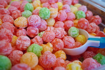 Colorful sugar coated rice balls for sale at market