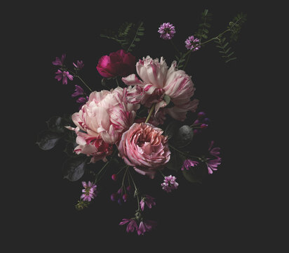 lush bouquet of flowers isolated against a dark background, floral center design element / motif made of peonies, roses and wildflowers in warm pink, cream and red colors for cards, wedding stationery
