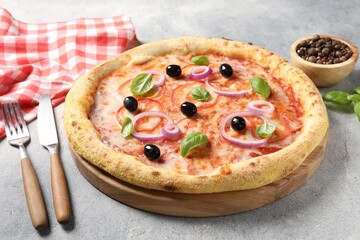 Delicious vegetarian pizza, peppercorns and cutlery on light grey table