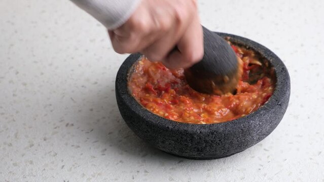 Sambel or Sambal Terasi made from tomatoes, chilies, salt, sugar, garlic, shallots and shrimp paste (terasi). Indonesian food
