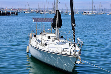 solar panels on a sailboat in the harbor