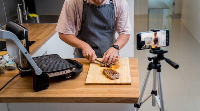 The chef is broadcasting live from workshop how to prepare a beef steaks on the electric grill