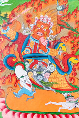 Obraz premium A detailed view of a vibrant tibetan deity painting displayed on a wall, Karcha Monastery in Zanskar