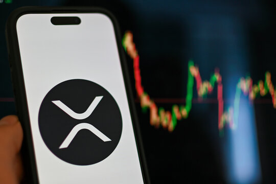 Germany - June 20,2024: XRP coin logo on phone