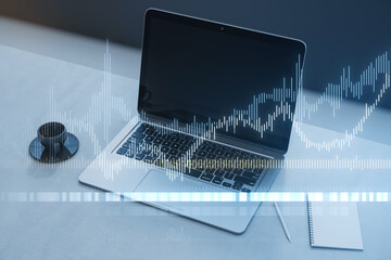A laptop with holographic financial charts overlay, set on a sleek desk with minimal accessories, evoking a high-tech analytical concept