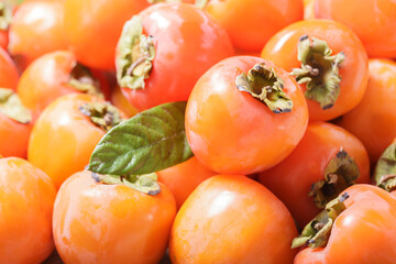 fresh ripe persimmon fruit as background