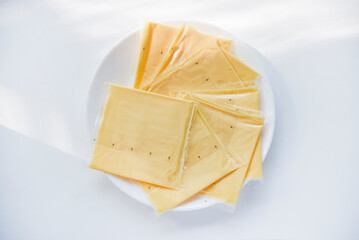 Melted cheese in flat slices. Processed cream cheese for sandwiches.