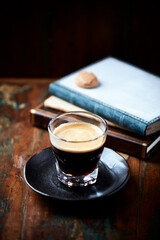 Coffee in glass cup on dark background. Close up. Copy space