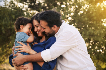 Happy Family Embracing in Nature