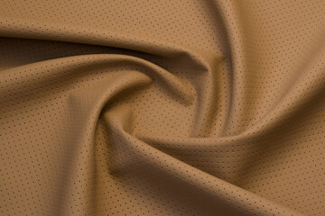 beige artificial leather with waves and folds on PVC base