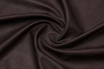 brown artificial leather with waves and folds on PVC base