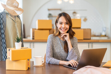 Portrait of owner asian woman freelancer sme business online shopping working checklist order and packing product, cardboard box, E-commerce, marketing, entrepreneur, Business online, startup concept