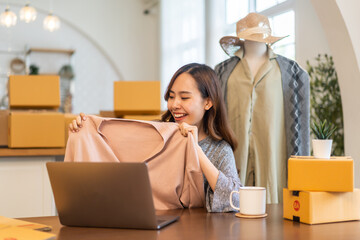 Portrait of owner asian woman freelancer sme business online shopping working checklist order and packing product, cardboard box, E-commerce, marketing, entrepreneur, Business online, startup concept