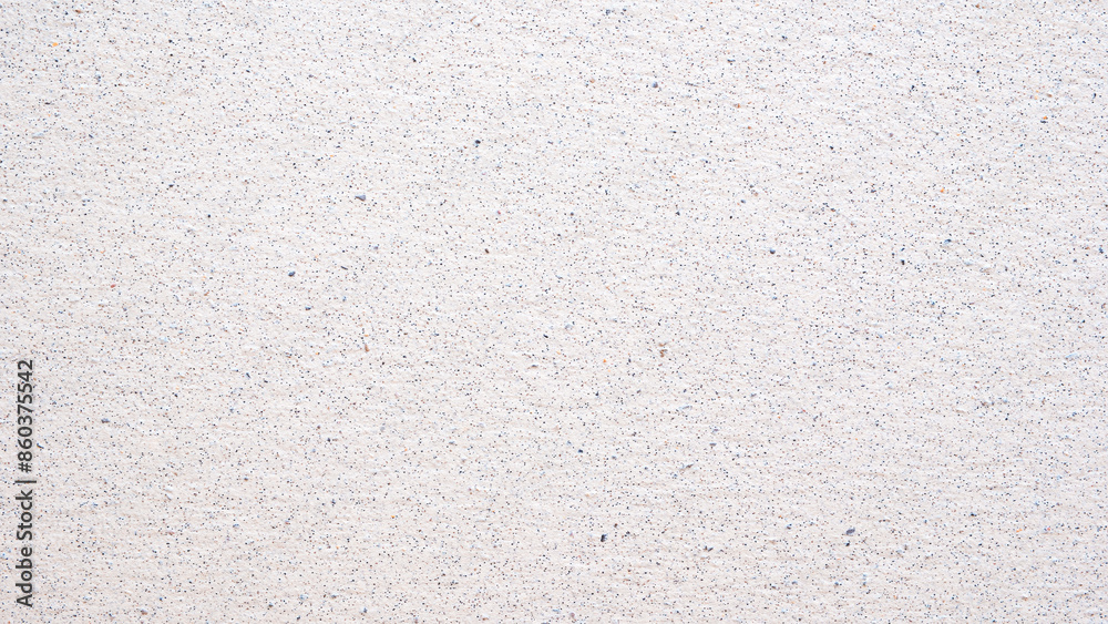 Aufkleber a white wall with a pattern of small dots. the wall is plain and unadorned. the dots are evenly spac