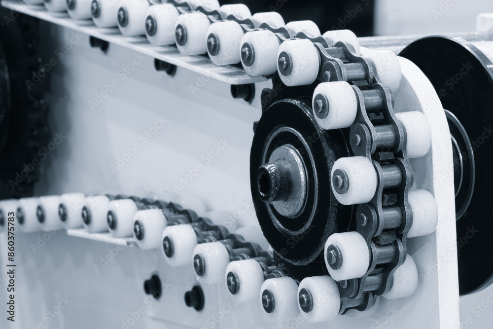Poster A chain with many white and black links. The chain is made of plastic and is used in a machine