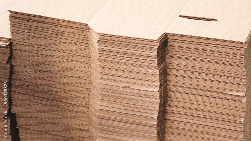 Poster cardboard is neatly placed in a stack for further use