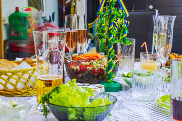 Close-up view of festive table with leftover food and empty glasses after drinking alcoholic beverages. Sweden.