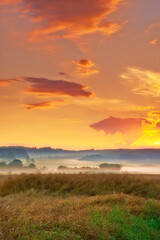 Farmland, landscape and sunrise for agriculture in nature with clouds, travel location and scenery in countryside. Meadow, environment and field with mockup, ecology and organic growth in Denmark